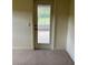 Patio access from bedroom via glass door providing exterior views and ample natural light at 10054 Hernando Ridge Rd, Weeki Wachee, FL 34613