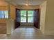 Bright foyer with tile flooring, an open view of the front yard through the front doors at 10054 Hernando Ridge Rd, Weeki Wachee, FL 34613