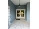 Elegant double front doors with glass inserts, sheltered by a covered porch area with decorative lighting at 10054 Hernando Ridge Rd, Weeki Wachee, FL 34613