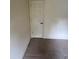 Neutral hallway showing doorframe, baseboard, and tan carpet at 10054 Hernando Ridge Rd, Weeki Wachee, FL 34613