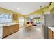Bright kitchen boasts wood cabinets, stainless appliances, and an adjacent dining area with natural light at 1009 Summer Breeze Dr, Brandon, FL 33511