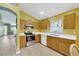 Bright kitchen with light wood cabinets, stainless steel appliances and large window at 1009 Summer Breeze Dr, Brandon, FL 33511