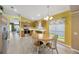 Eat-in kitchen with stainless steel appliances, light wood cabinets, and open view to the front yard at 1009 Summer Breeze Dr, Brandon, FL 33511