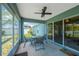 Screened lanai featuring a ceiling fan and outdoor dining set, connecting indoor and outdoor living spaces at 1009 Summer Breeze Dr, Brandon, FL 33511