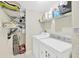 Functional laundry room with a washer, dryer, storage shelves, and tiled floor at 1009 Summer Breeze Dr, Brandon, FL 33511