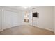 Neutral bedroom with carpeting, a closet, and a television on the wall at 10296 Palmgren, Spring Hill, FL 34608