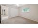 Bedroom with carpet, closet, window, and neutral walls at 10296 Palmgren, Spring Hill, FL 34608