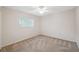 Bedroom with neutral walls, window, and carpet flooring at 10296 Palmgren, Spring Hill, FL 34608