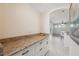 Functional butler's pantry with ample storage and granite countertops at 10296 Palmgren, Spring Hill, FL 34608