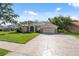 Beautiful single Gathering home featuring an attached two car garage and a manicured lawn at 10296 Palmgren, Spring Hill, FL 34608