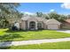 Beautiful single Gathering home on a lush green lot with mature shade trees at 10296 Palmgren, Spring Hill, FL 34608