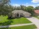 Well-maintained home with lush green lawn and mature trees in a desirable neighborhood at 10296 Palmgren, Spring Hill, FL 34608