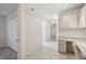 Hallway with built-in desk, closet, and tile flooring at 10296 Palmgren, Spring Hill, FL 34608