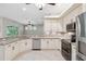 Bright kitchen features granite counters and stainless appliances at 10296 Palmgren, Spring Hill, FL 34608