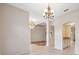 Open living space with hardwood floors, chandelier, and views into other rooms at 10296 Palmgren, Spring Hill, FL 34608