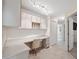Office with a built-in desk, cabinets, and tile flooring at 10296 Palmgren, Spring Hill, FL 34608