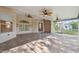 Spacious screened patio with unique flooring, ceiling fans, and access to the outdoors at 10296 Palmgren, Spring Hill, FL 34608
