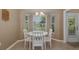 Cozy breakfast nook bathed in natural light, overlooking the backyard at 1105 Flora Vista St, New Port Richey, FL 34655