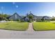 Beautifully landscaped clubhouse with manicured lawn, American flag, and easy access at 1105 Flora Vista St, New Port Richey, FL 34655