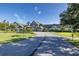 Clubhouse exterior with beautiful landscaping and a welcoming entryway at 1105 Flora Vista St, New Port Richey, FL 34655