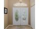 A close up of a double door entrance with leaded glass and sidelights at 1105 Flora Vista St, New Port Richey, FL 34655