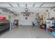 Spacious two car garage with epoxy floors and ample storage shelving at 1105 Flora Vista St, New Port Richey, FL 34655