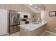 Modern kitchen with stainless steel appliances, quartz countertops, and ample cabinet space at 1105 Flora Vista St, New Port Richey, FL 34655