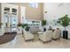 Spacious lobby with elegant seating, high ceilings, and views of the lake through large windows at 1105 Flora Vista St, New Port Richey, FL 34655