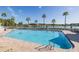 Inviting pool with plenty of chairs and beautiful view of lake at 1105 Flora Vista St, New Port Richey, FL 34655