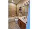 Cozy bathroom featuring a shower and tub combo with wood cabinetry and tile backsplash at 11055 Belle Haven Dr, New Port Richey, FL 34654