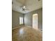 Comfortable bedroom with tile floors, bright window and neutral paint at 11055 Belle Haven Dr, New Port Richey, FL 34654