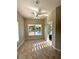 A bright bonus room featuring tile floors and an outdoor view of the pool and backyard at 11055 Belle Haven Dr, New Port Richey, FL 34654