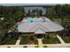 Community clubhouse overlooking pool and clear lake at 11055 Belle Haven Dr, New Port Richey, FL 34654