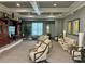 Relaxing common area with comfortable seating, a large TV, and stylish decor for social gatherings at 11055 Belle Haven Dr, New Port Richey, FL 34654