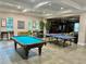 Community game room with pool table, foosball, and ping pong table at 11055 Belle Haven Dr, New Port Richey, FL 34654