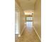 Inviting hallway featuring tile flooring and an archway leading to the living area at 11055 Belle Haven Dr, New Port Richey, FL 34654