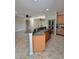 Kitchen showcasing a breakfast bar, tile floors, and an open layout for easy entertaining at 11055 Belle Haven Dr, New Port Richey, FL 34654