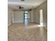 Open living room showcasing tile floors and neutral walls, perfect for entertaining at 11055 Belle Haven Dr, New Port Richey, FL 34654