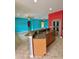 Bright living room with kitchen access featuring modern appliances and unique design touches at 11055 Belle Haven Dr, New Port Richey, FL 34654