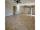 Expansive living room with tile floors, neutral tones, and access to other rooms at 11055 Belle Haven Dr, New Port Richey, FL 34654
