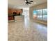 Open living space featuring a breakfast bar area and large windows providing natural light at 11055 Belle Haven Dr, New Port Richey, FL 34654