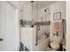 Modern bathroom featuring a glass shower door, and stylish white tile, and neutral décor at 1108 Blackwater Dr, Wesley Chapel, FL 33543