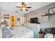 Relaxing bedroom features a ceiling fan, hardwood floors, and a neutral color scheme at 1108 Blackwater Dr, Wesley Chapel, FL 33543