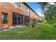 Exterior view of the home showcasing a lawn, outdoor space, and colorful facade at 1108 Blackwater Dr, Wesley Chapel, FL 33543