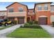 A lovely multi-colored townhome with well maintained landscaping, and a yellow SUV parked on the driveway at 1108 Blackwater Dr, Wesley Chapel, FL 33543