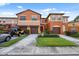 Townhome featuring multi-toned paint, garages, landscaping, and a welcoming entrance at 1108 Blackwater Dr, Wesley Chapel, FL 33543