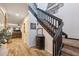 Welcoming foyer with wood-look tile flooring and staircase at 1108 Blackwater Dr, Wesley Chapel, FL 33543
