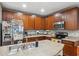 The kitchen features a large island, stainless appliances, and wood cabinets at 1108 Blackwater Dr, Wesley Chapel, FL 33543