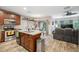 Open kitchen layout with stainless steel appliances and wood cabinetry at 1108 Blackwater Dr, Wesley Chapel, FL 33543
