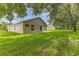 Side view of house highlighting its well-kept lawn, windows, and enclosed patio at 11158 Heathrow Ave, Spring Hill, FL 34609